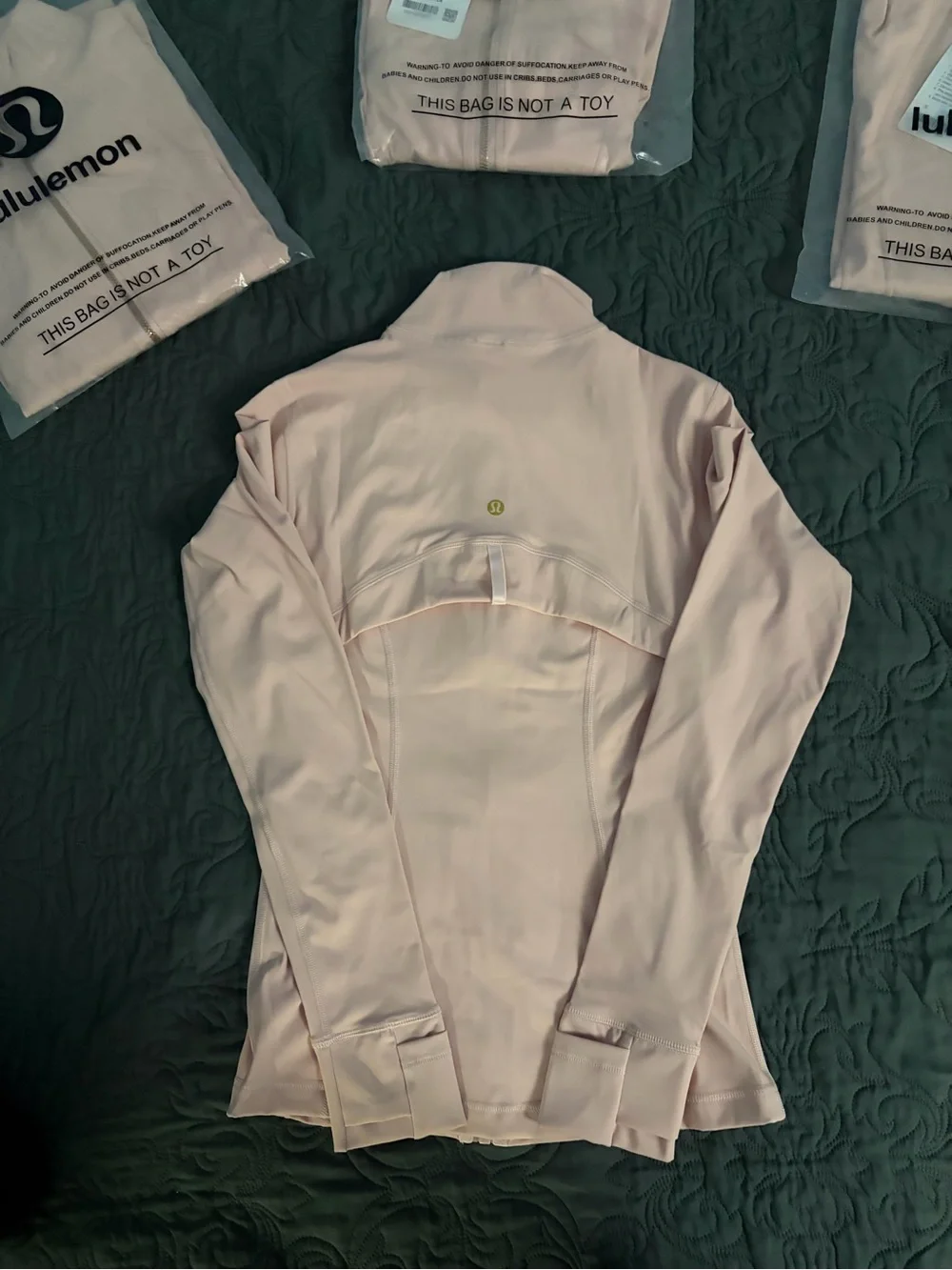 Pink Lululemon Define Jacket with Gold zipper and gold pocket zipper